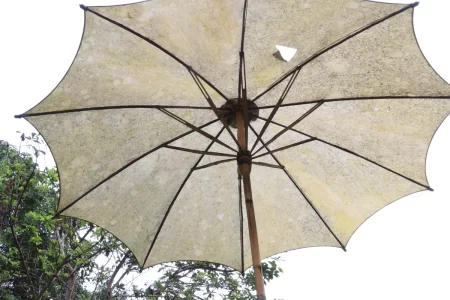 A parasol with torn fabric
