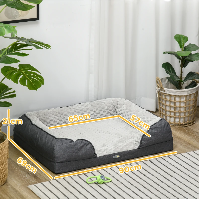 Dog bed size dimensions shown on soft grey bolster bed