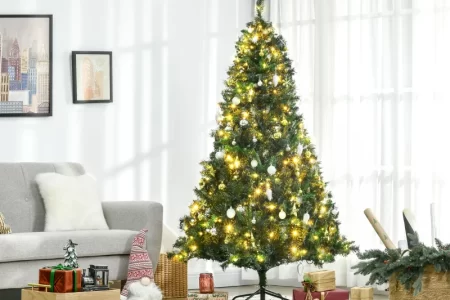 Living room Christmas tree with warm lights and gifts.