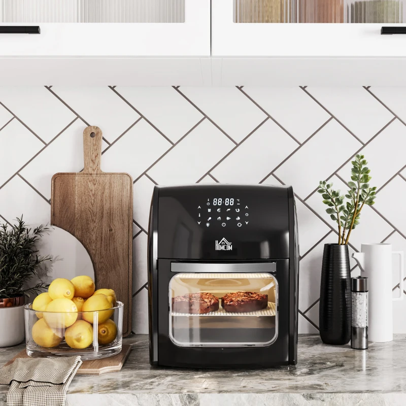 Modern air fryers and mini ovens on kitchen counter promoting healthy cooking discounts.
