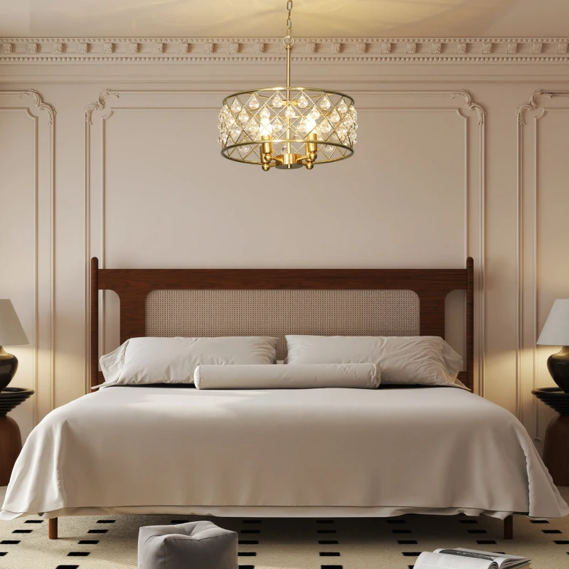 Elegant bedroom with crystal chandelier above neatly made bed.