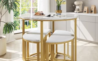 Modern white dining area with light wood table, four chairs, and indoor plants.