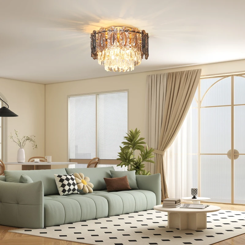 Modern living room with crystal chandelier and light green sofa.