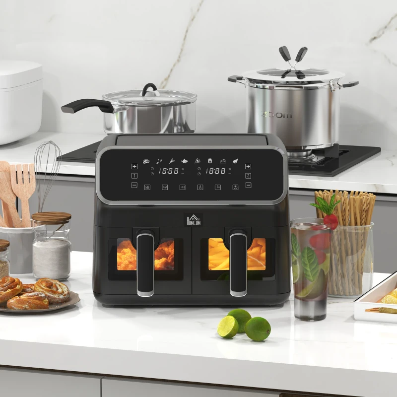 Dual basket digital air fryer with LED display cooking fries and chicken in modern kitchen.
