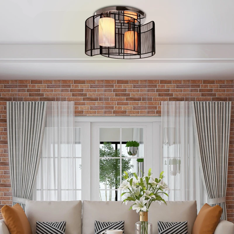 Living room with black wire-frame chandelier and brick accent wall.