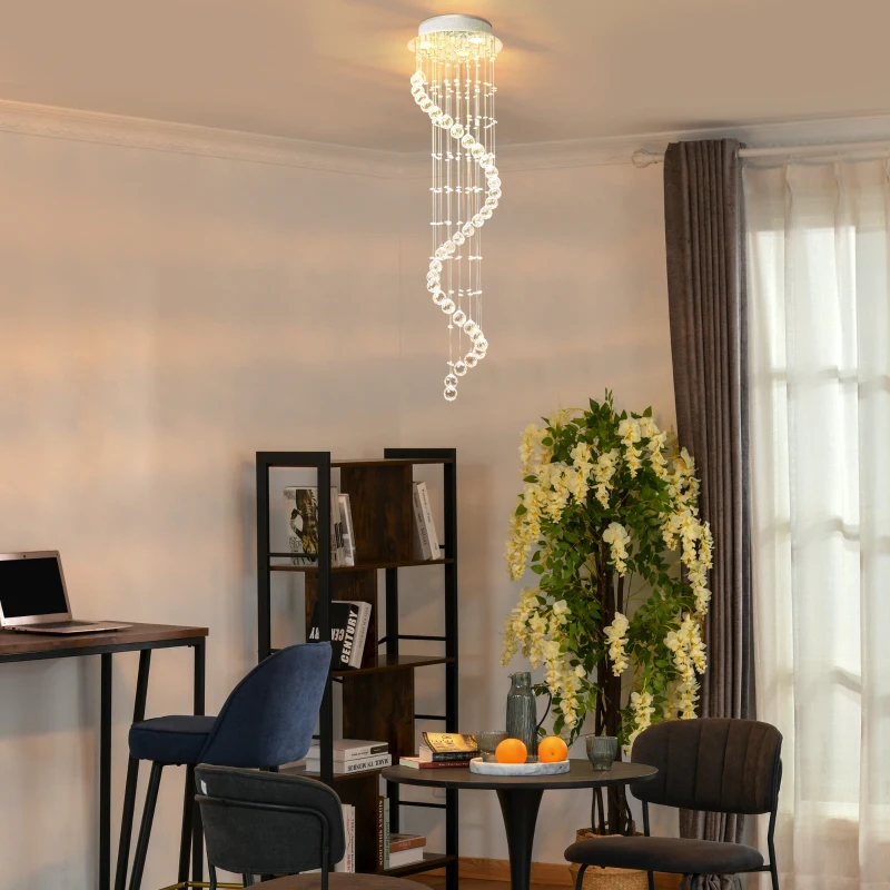 Spiral crystal pendant chandelier illuminating cosy home workspace.