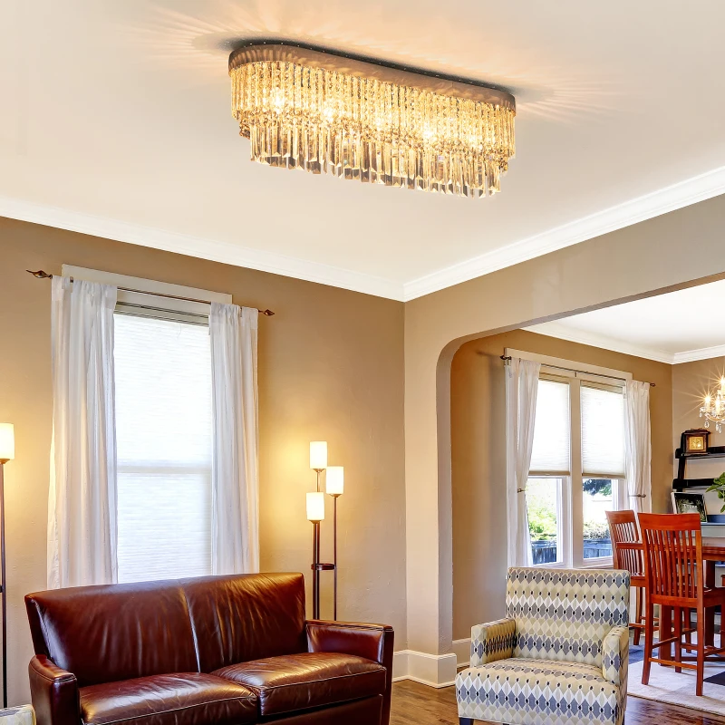 Bright living space featuring rectangular crystal chandelier ceiling light.