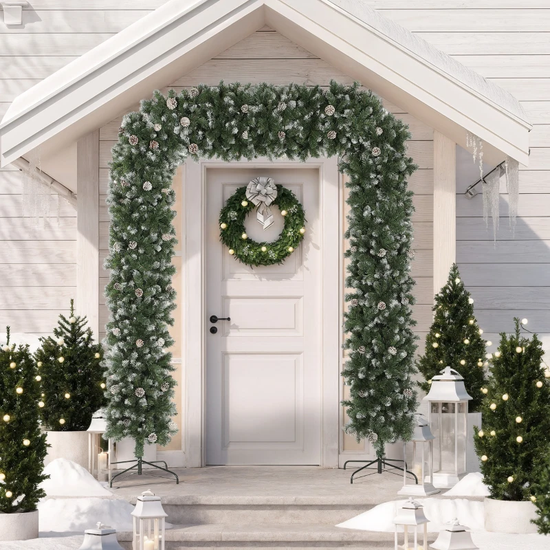 Snow-covered holiday doorway decorated with garland and trees.