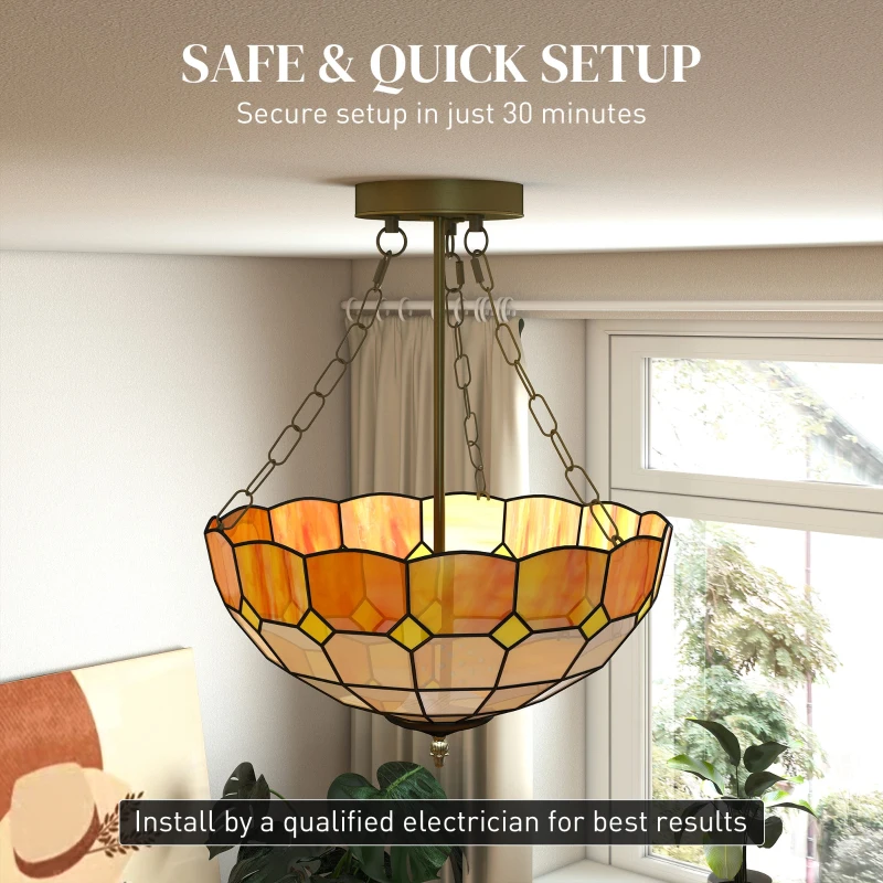Warm stained-glass pendant chandelier hanging near large window.