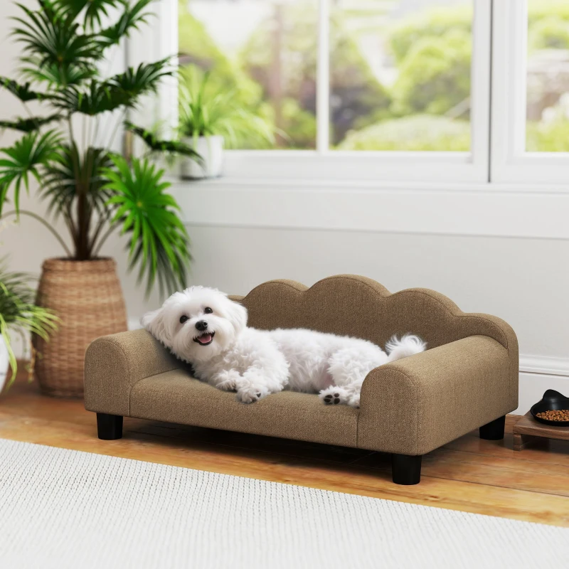 Small grey dog bed placed beside bed in modern room