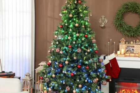 Christmas tree decorated with colorful lights and presents below