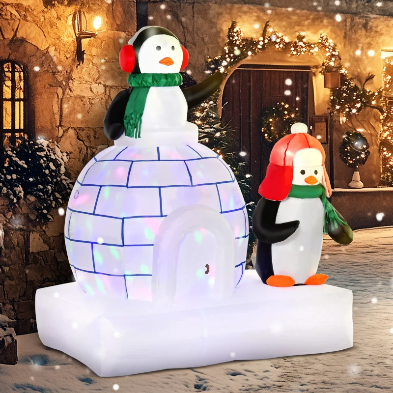 Penguins beside glowing igloo in snowy Christmas yard