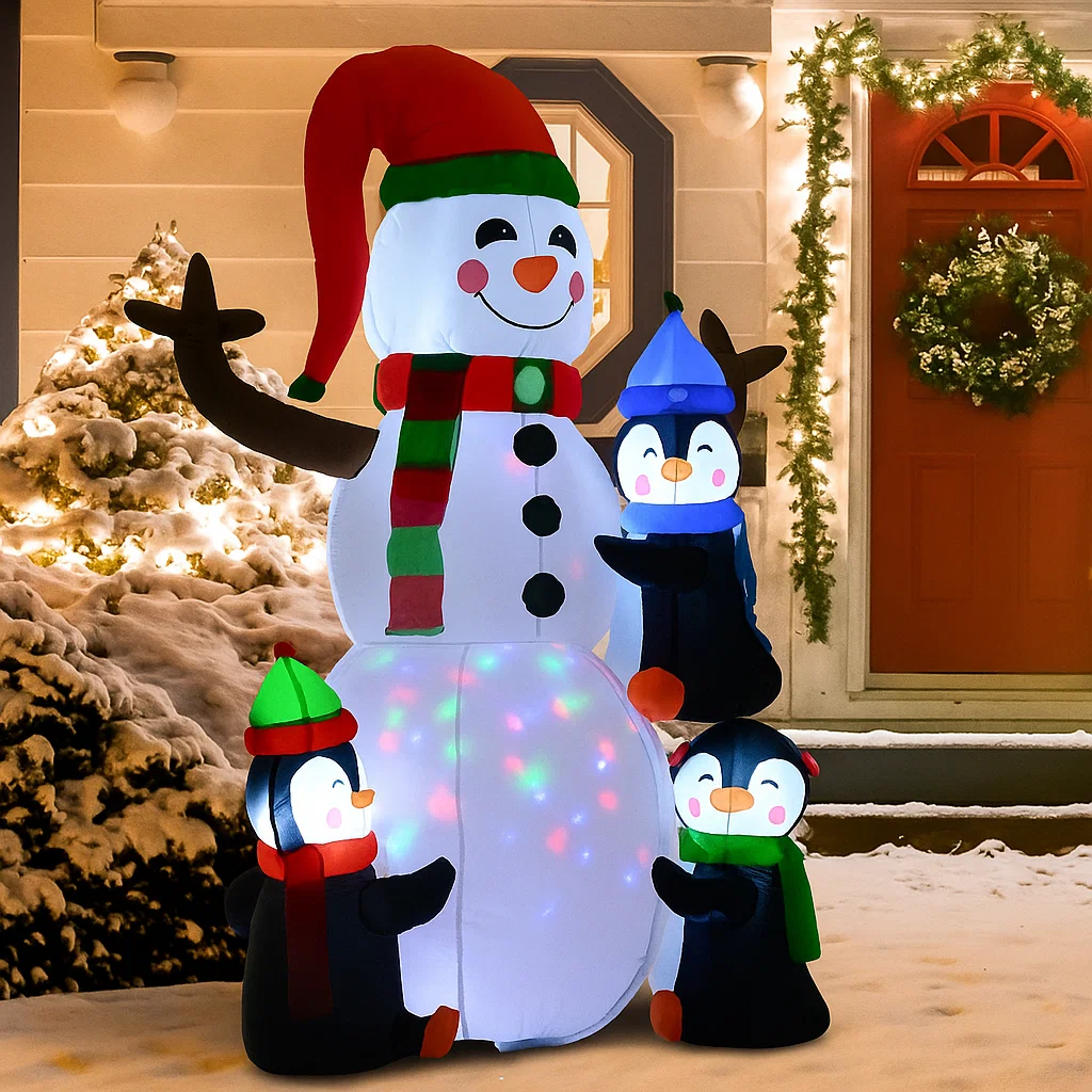 Snowman with penguins and glowing LED lights outdoors