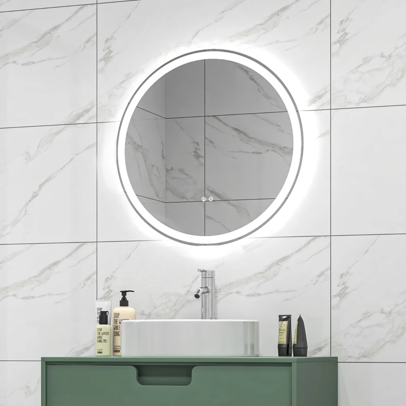Illuminated round LED mirror above sink in marble bathroom