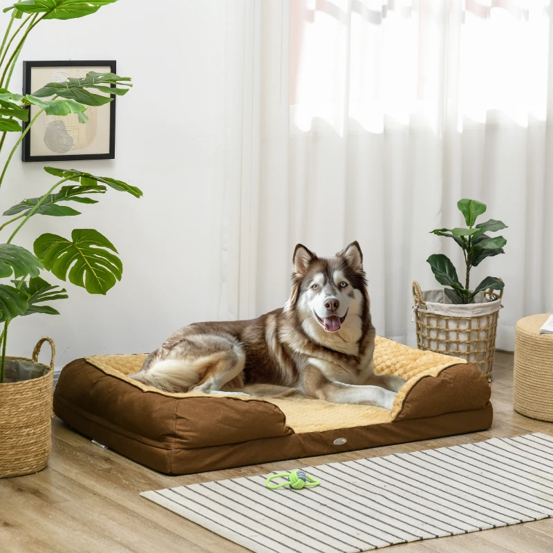 Large husky lying on soft brown and beige dog bed in bright cozy living room.