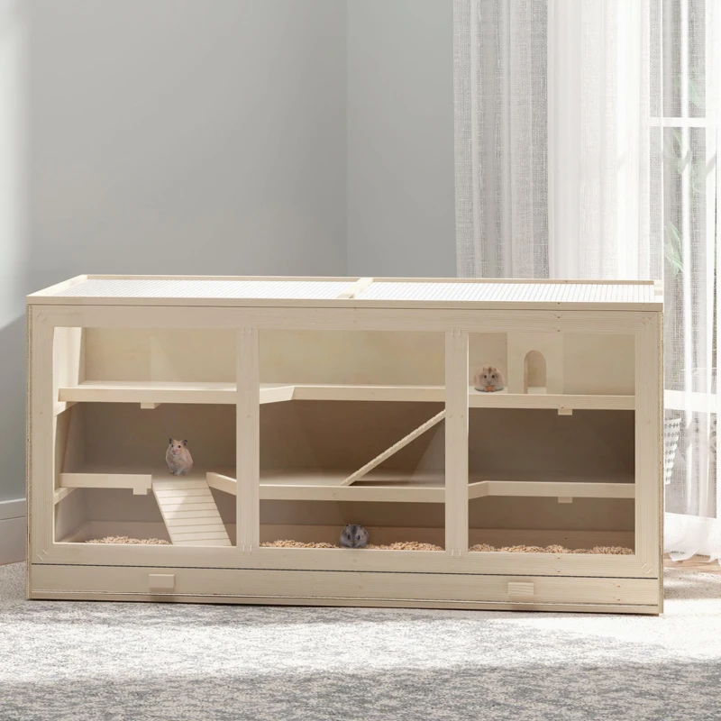 Wide, multi-level wooden hutch with internal ramps and bedding on floor.

