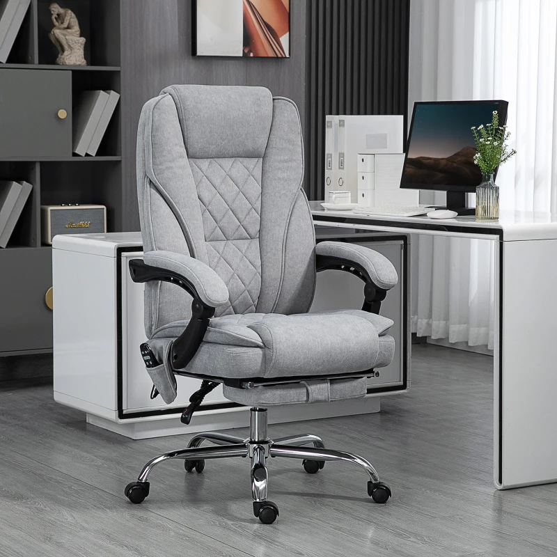 Gray cushioned office chair with footrest in bright office