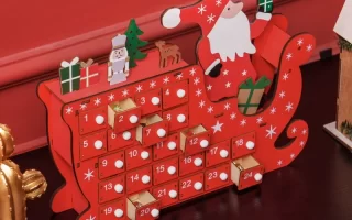 red Santa sleigh calendar with open drawers