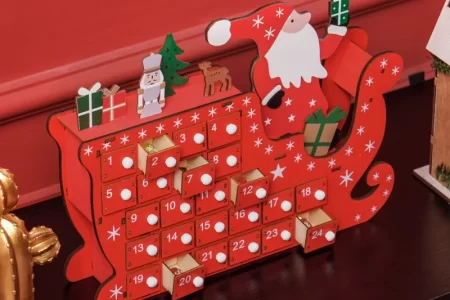 red Santa sleigh calendar with open drawers