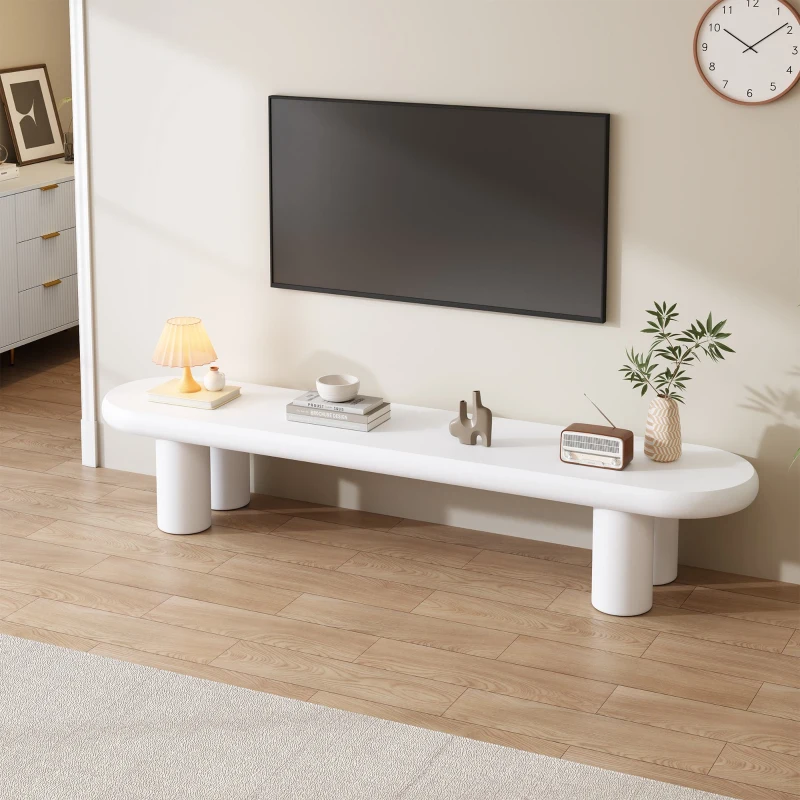 White wooden TV stand with rounded edges and clean décor 