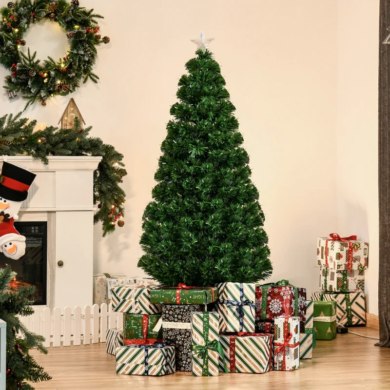 Artificial Christmas tree with wrapped presents around base.