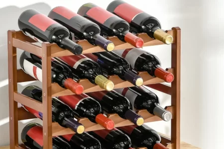Fully assembled wooden wine rack filled with multiple wine bottles on four storage tiers.
