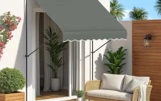 Outdoor freestanding awning shading a patio seating area.